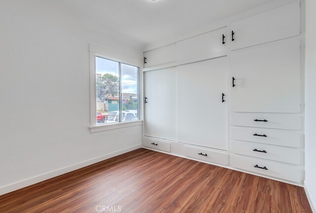 1677 252nd St, Harbor City, CA 90710 - unfurnished bedroom featuring wood finished floors and a closet