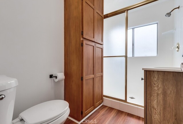 1677 252nd St, Harbor City, CA 90710 - bathroom featuring a shower stall, wood finished floors, and vanity
