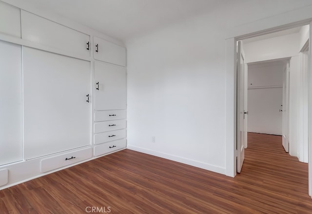 1677 252nd St, Harbor City, CA 90710 - unfurnished bedroom featuring dark wood-type flooring and a closet