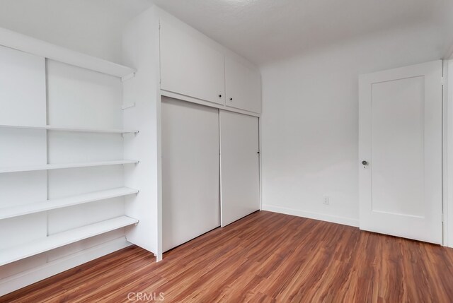 1677 252nd St, Harbor City, CA 90710 - unfurnished bedroom with light wood-style flooring and a closet