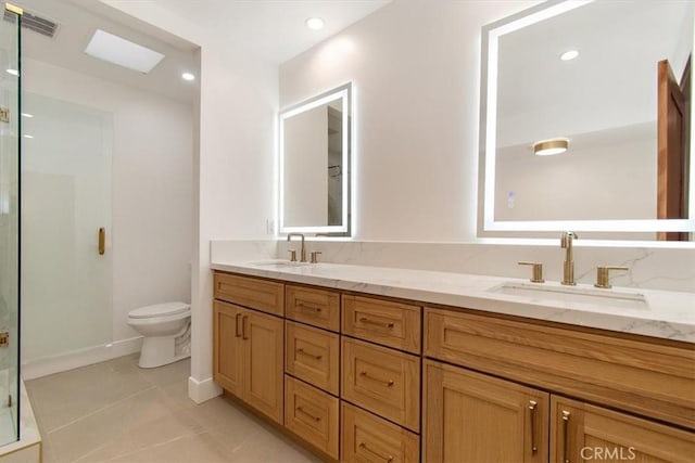 13044 Mindanao Way Unit 3, Marina Del Rey, CA 90292 - full bathroom featuring a shower stall, toilet, double vanity, tile patterned floors, and baseboards
