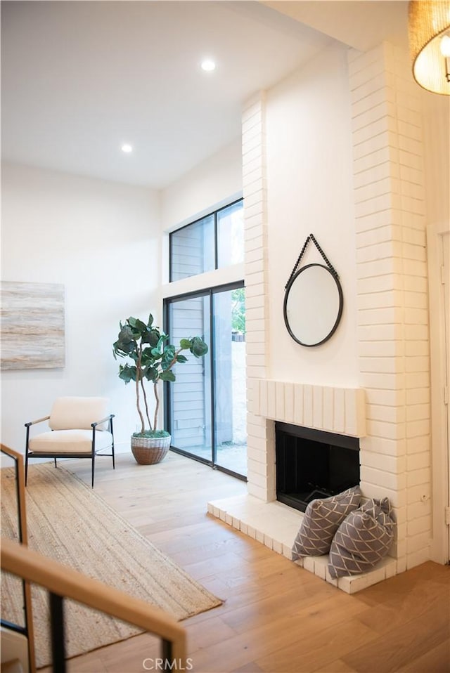 13044 Mindanao Way Unit 3, Marina Del Rey, CA 90292 - living area with wood finished floors, recessed lighting, and a brick fireplace