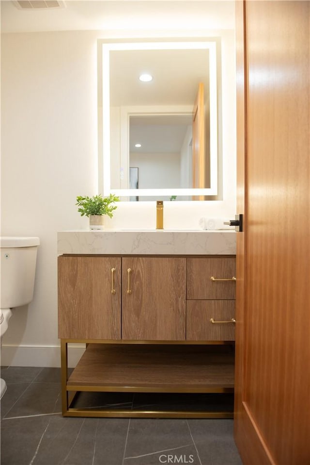 13044 Mindanao Way Unit 3, Marina Del Rey, CA 90292 - bathroom featuring toilet, tile patterned flooring, baseboards, and vanity