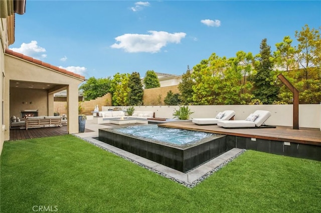 view of yard with an outdoor hangout area, a deck, and a hot tub