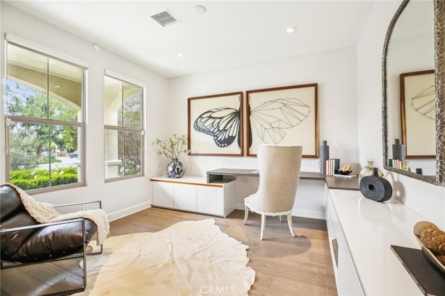 office featuring light wood-style floors, baseboards, and recessed lighting