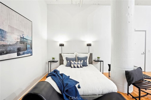 bedroom featuring wood finished floors