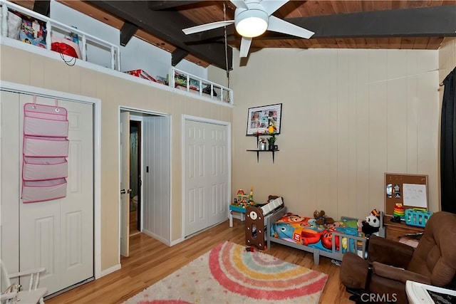 770 Berne Dr, Crestline, CA 92325 - playroom with ceiling fan, wood finished floors, wooden walls, and baseboards