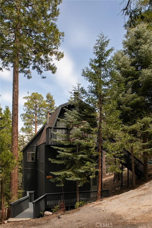 265 Grizzly Rd, Lake Arrowhead, CA 92317 - view of home's exterior with a gambrel roof and a chimney