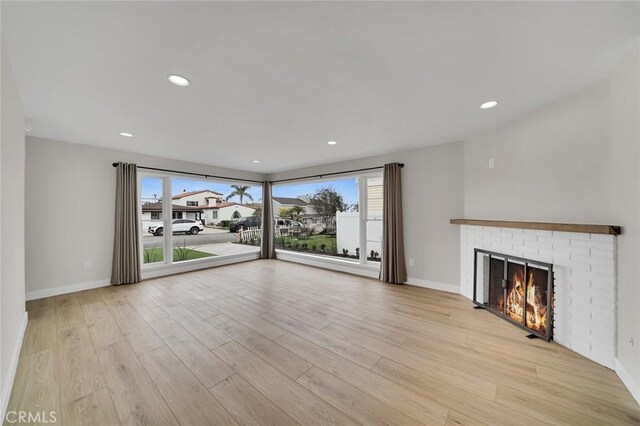 212 La Paloma, San Clemente, CA 92672 - unfurnished living room with light wood finished floors, baseboards, a fireplace, and recessed lighting