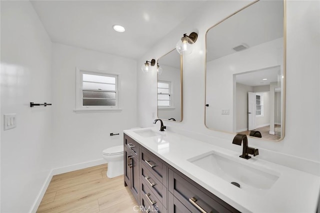 212 La Paloma, San Clemente, CA 92672 - bathroom with toilet, wood finished floors, baseboards, and double vanity