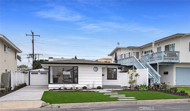 212 La Paloma, San Clemente, CA 92672 - view of front facade featuring concrete driveway, a garage, stairs, and an outdoor structure