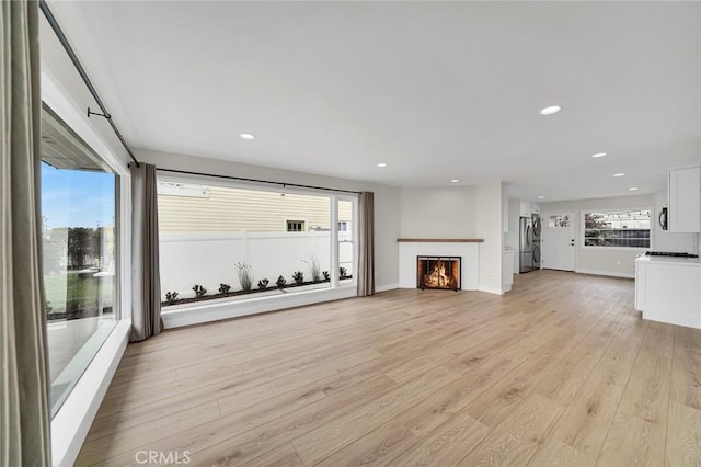 212 La Paloma, San Clemente, CA 92672 - unfurnished living room featuring light wood-style floors, recessed lighting, a fireplace, and baseboards