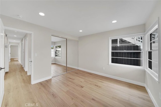 212 La Paloma, San Clemente, CA 92672 - unfurnished bedroom featuring light wood-style floors, a closet, baseboards, and recessed lighting
