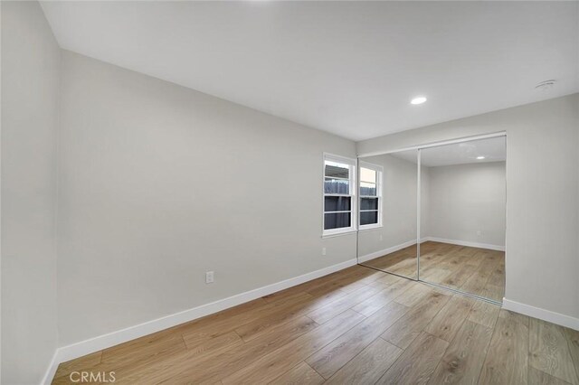 212 La Paloma, San Clemente, CA 92672 - unfurnished bedroom with wood finished floors, baseboards, recessed lighting, and a closet