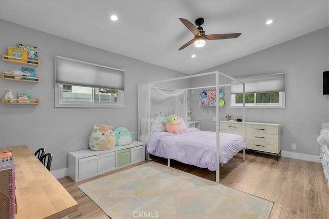 bedroom featuring light wood-style flooring, vaulted ceiling, baseboards, recessed lighting, and a ceiling fan