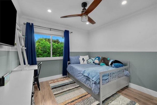 bedroom featuring ornamental molding, baseboards, wood finished floors, recessed lighting, and ceiling fan