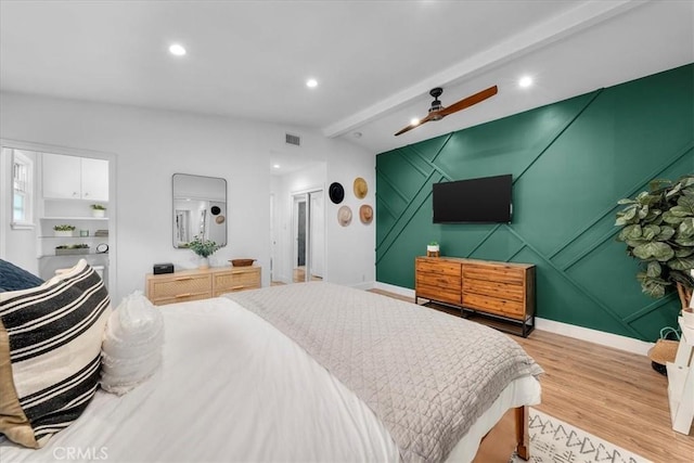 bedroom with wood finished floors, a ceiling fan, and recessed lighting
