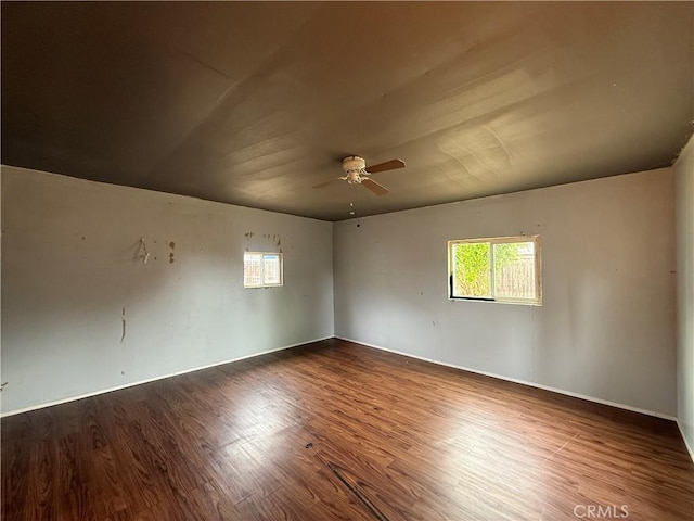 empty room featuring wood finished floors and ceiling fan