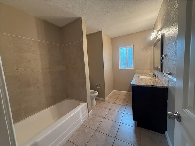 full bathroom featuring toilet, a textured ceiling, tile patterned floors, vanity, and baseboards