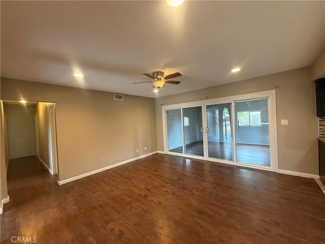 unfurnished room featuring a ceiling fan, dark wood-style floors, baseboards, and recessed lighting