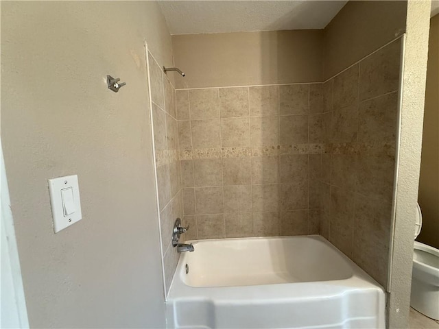 full bathroom featuring shower / bath combination and toilet