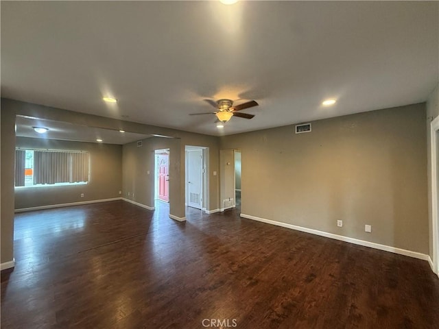 empty room featuring baseboards, a ceiling fan, dark wood-style flooring, and recessed lighting