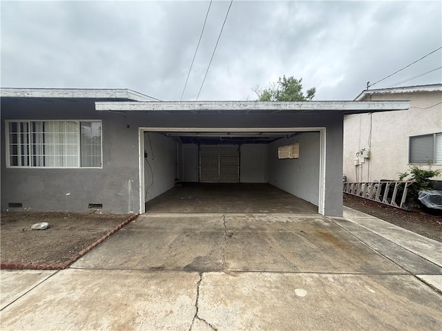 garage featuring driveway
