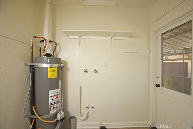utility room featuring water heater