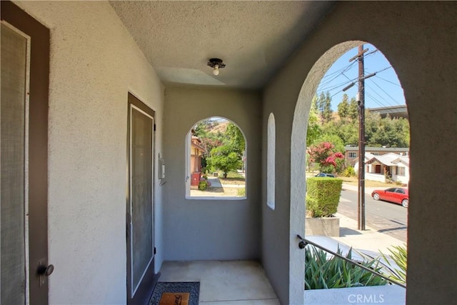 doorway to property with stucco siding