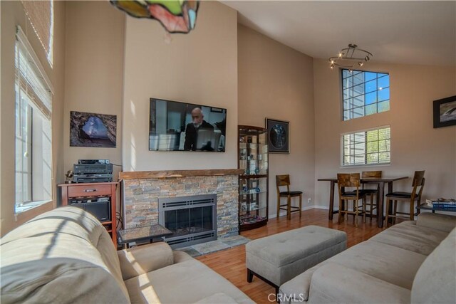 539 Elk Ridge Way, San Jose, CA 95136 - living area with a high ceiling, wood finished floors, a fireplace, and baseboards