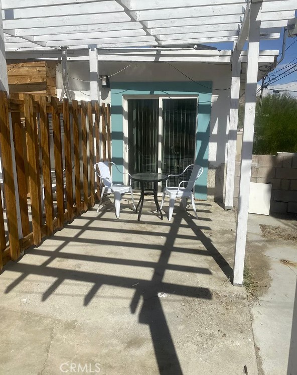 66229 8th St, Desert Hot Springs, CA 92240 - view of patio featuring a pergola