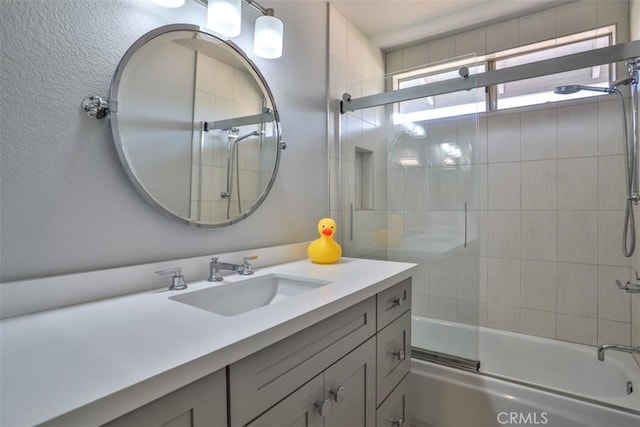 1398 Carissa St, Upland, CA 91784 - bathroom featuring vanity, shower / bath combination with glass door, and a textured wall