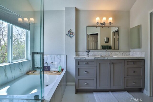 1398 Carissa St, Upland, CA 91784 - full bathroom with vanity, a bath, tile patterned flooring, and baseboards
