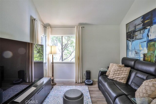 1398 Carissa St, Upland, CA 91784 - living room with wood finished floors, baseboards, and lofted ceiling