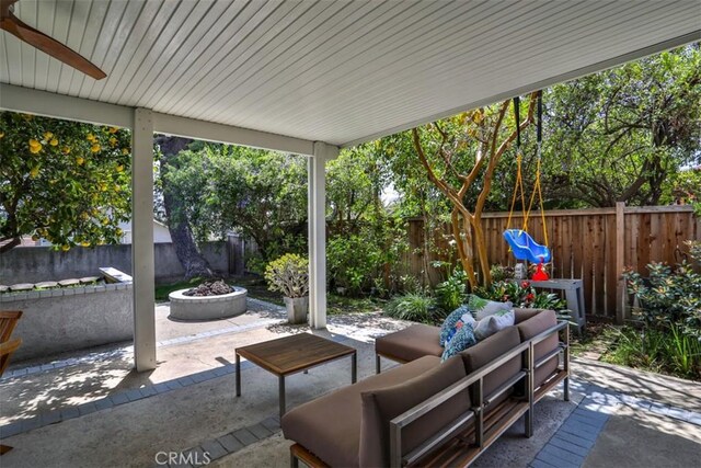 1398 Carissa St, Upland, CA 91784 - fenced backyard with a patio and an outdoor living space with a fire pit