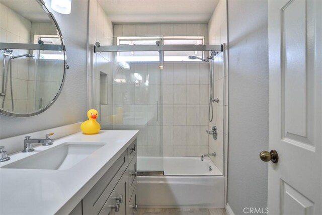 1398 Carissa St, Upland, CA 91784 - bathroom featuring vanity and combined bath / shower with glass door