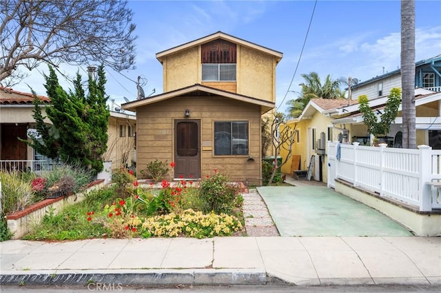 view of front of house with fence