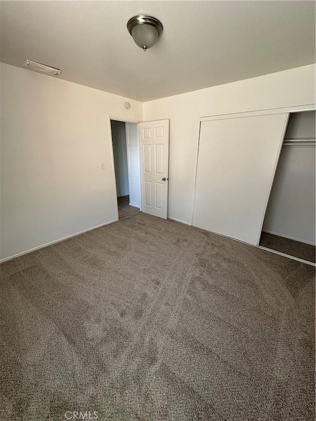 44226 2nd St E, Lancaster, CA 93535 - unfurnished bedroom featuring carpet flooring, a closet, and baseboards