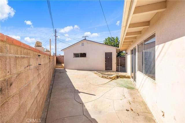 44226 2nd St E, Lancaster, CA 93535 - view of patio / terrace with a fenced backyard and an outbuilding