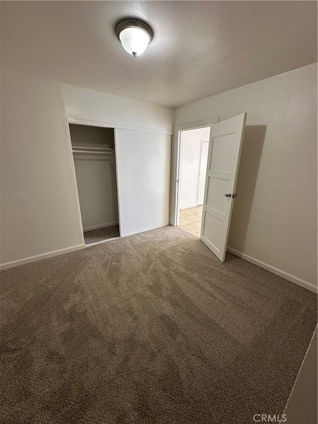 44226 2nd St E, Lancaster, CA 93535 - unfurnished bedroom with carpet flooring, a closet, and baseboards
