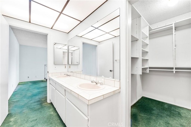 16512 Blackbeard Ln Unit 102, Huntington Beach, CA 92649 - bathroom with carpet flooring, baseboards, and double vanity