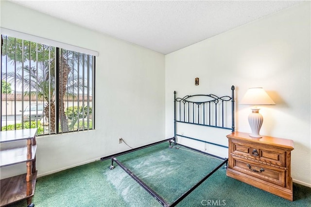 16512 Blackbeard Ln Unit 102, Huntington Beach, CA 92649 - unfurnished bedroom with carpet floors, baseboards, and a textured ceiling