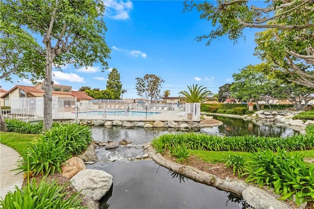 16512 Blackbeard Ln Unit 102, Huntington Beach, CA 92649 - surrounding community featuring fence and a swimming pool