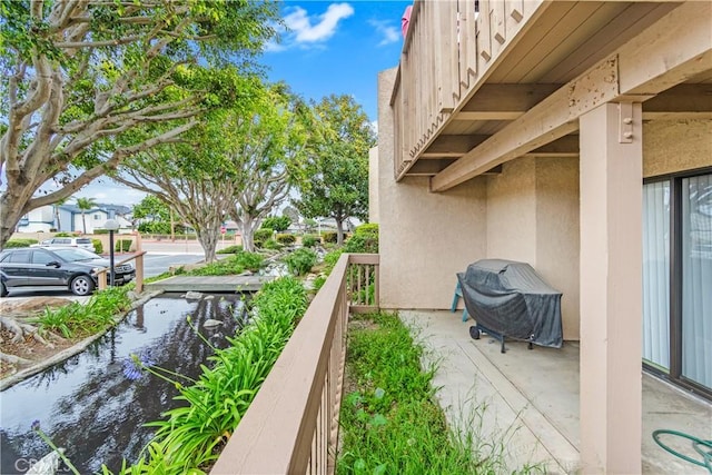 16512 Blackbeard Ln Unit 102, Huntington Beach, CA 92649 - balcony featuring a water view and grilling area