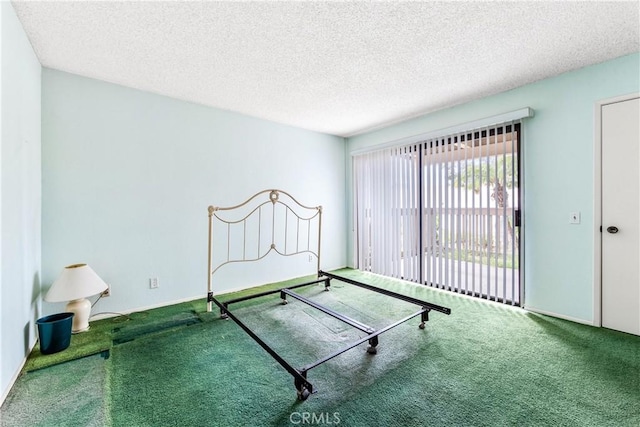 16512 Blackbeard Ln Unit 102, Huntington Beach, CA 92649 - carpeted bedroom with a textured ceiling and access to outside