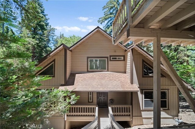 view of front of home with roof with shingles