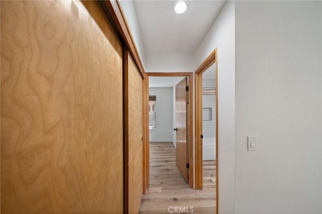 hall with light wood-style floors