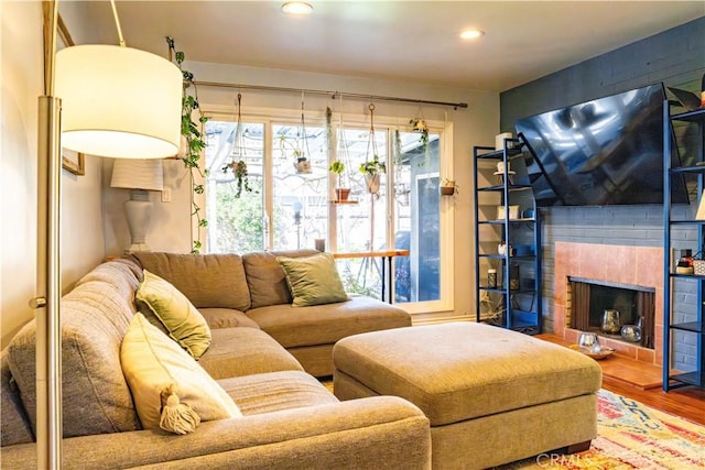 18711 Cerise Ave, Torrance, CA 90504 - living room with wood finished floors, a tile fireplace, and recessed lighting