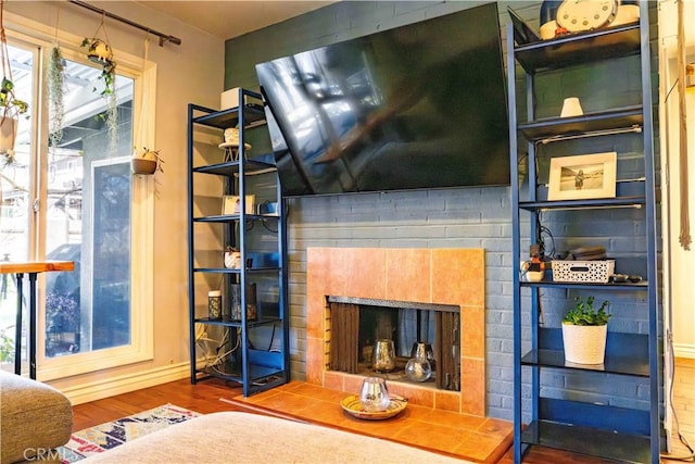 18711 Cerise Ave, Torrance, CA 90504 - living area with wood finished floors, a fireplace, and baseboards