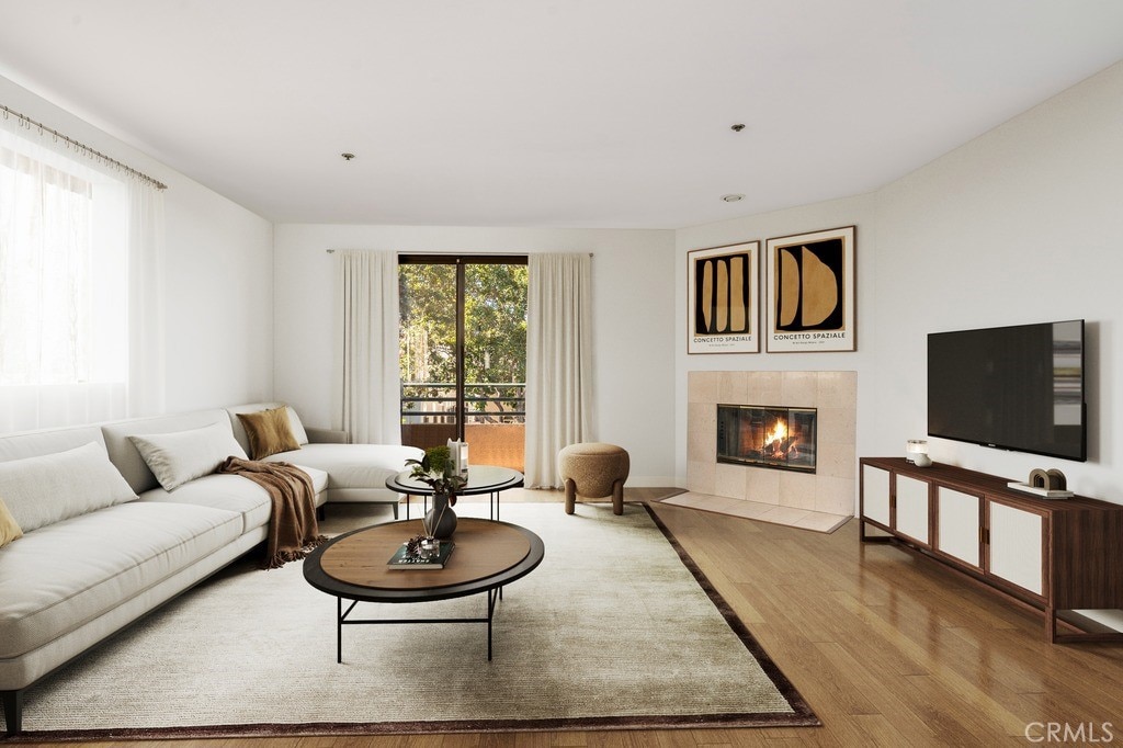 1128 Cardiff Ave Unit 201, Los Angeles, CA 90035 - living room featuring wood finished floors and a tiled fireplace